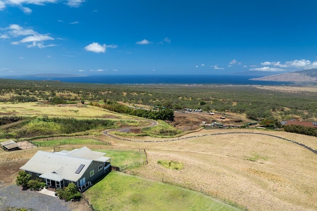 birds eye view of property with a rural view