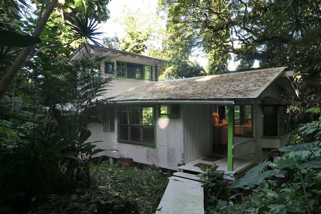 exterior space featuring a sunroom