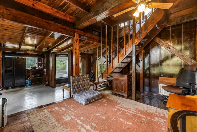 interior space featuring dark hardwood / wood-style flooring, ceiling fan, wood walls, and wood ceiling