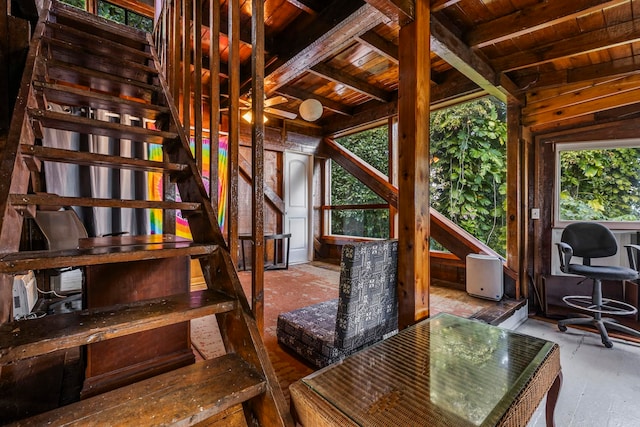 interior space featuring beam ceiling and wood ceiling