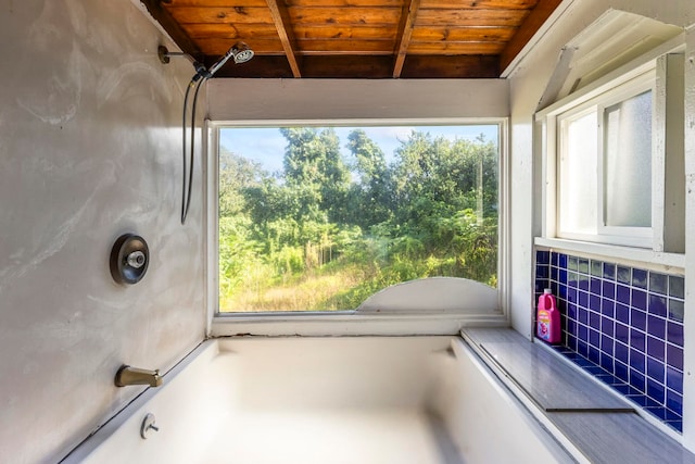 bathroom with decorative backsplash and wood ceiling