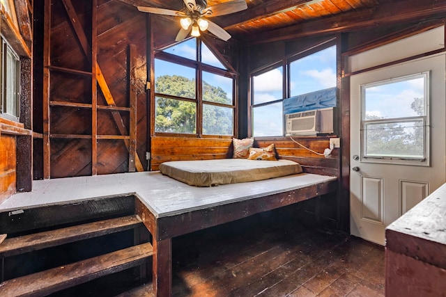 interior space with beam ceiling, ceiling fan, cooling unit, and wood ceiling