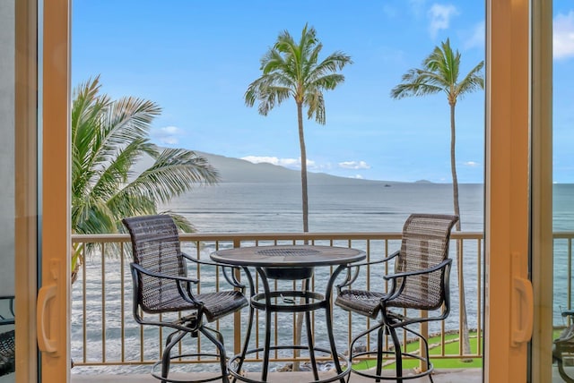 exterior space featuring a water and mountain view