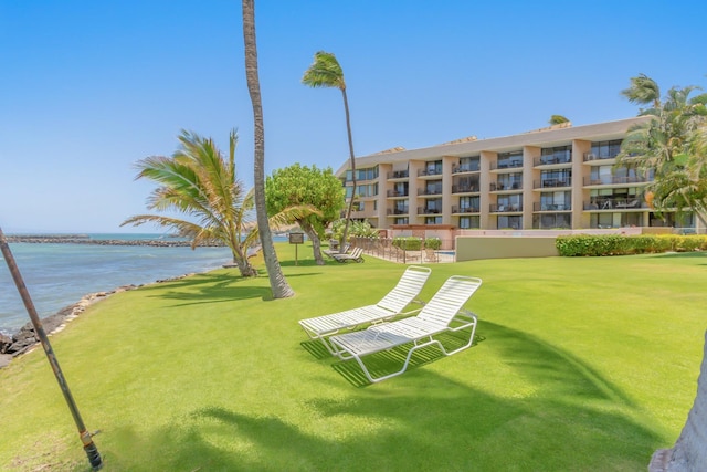surrounding community featuring a water view