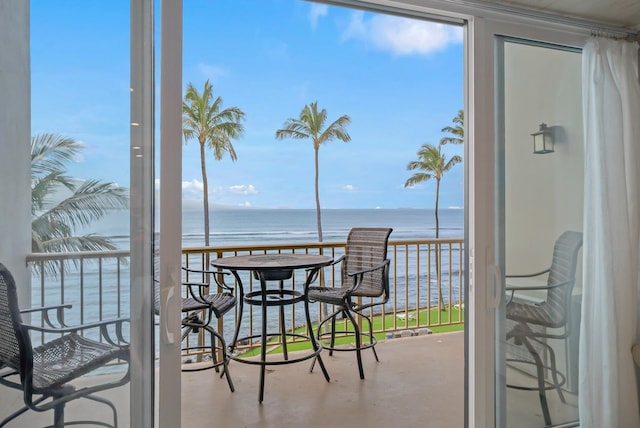 interior space featuring concrete floors and a water view