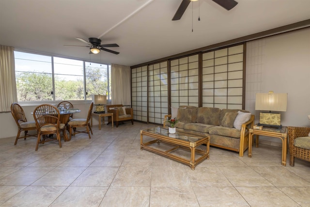 tiled living room with ceiling fan