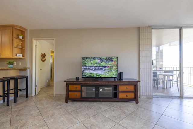 living room with light tile patterned floors