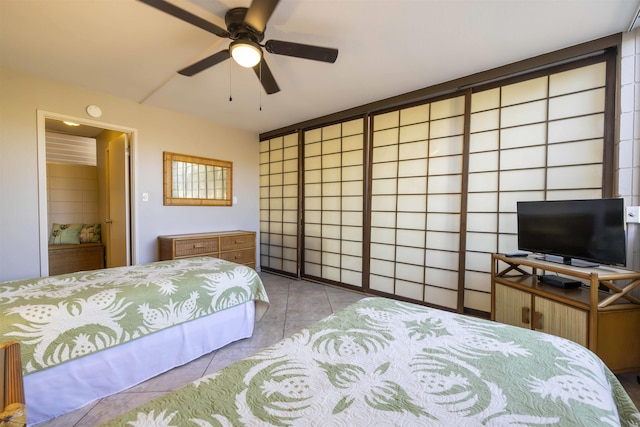 tiled bedroom with ceiling fan