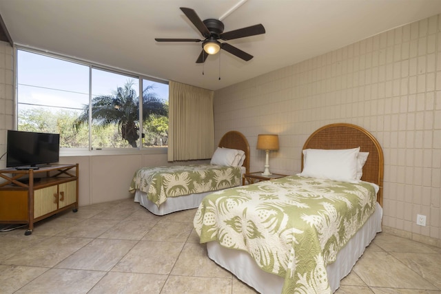 tiled bedroom with ceiling fan