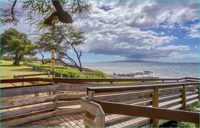 surrounding community featuring a water view