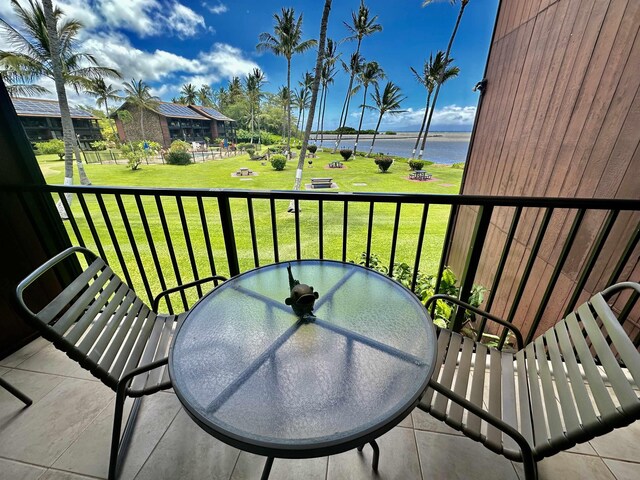 balcony featuring a water view