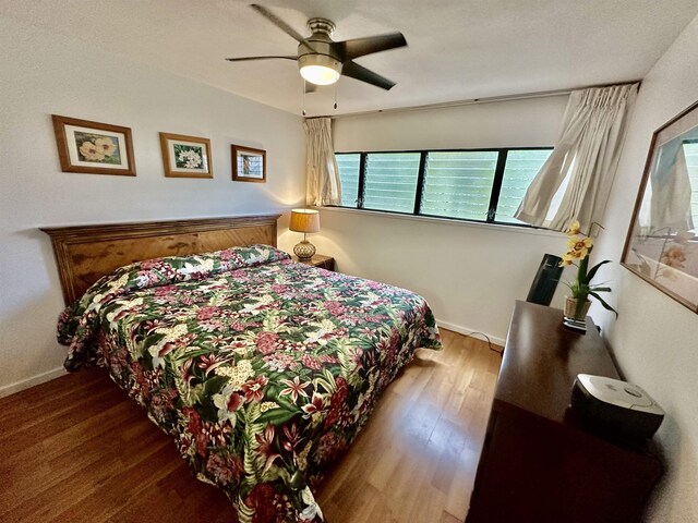 bedroom featuring ceiling fan and wood-type flooring