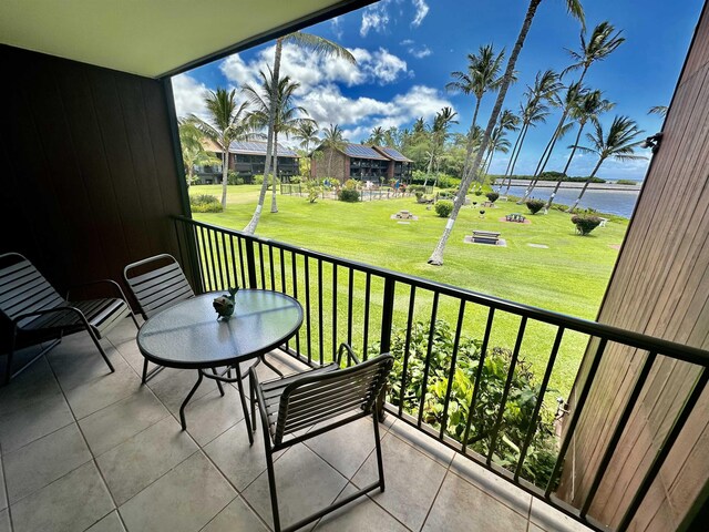 balcony featuring a water view