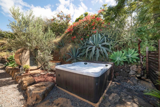 view of yard with a hot tub