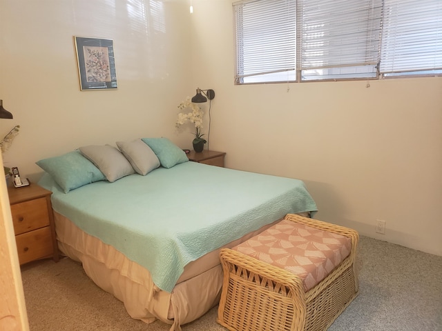 bedroom with light colored carpet