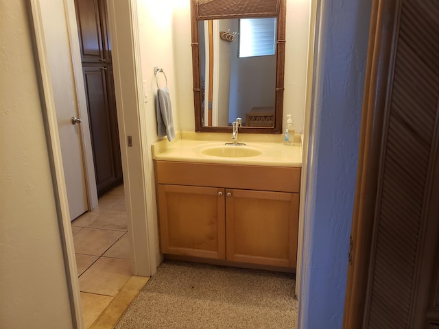 bathroom featuring tile floors and vanity