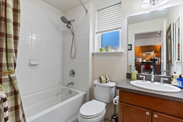 full bathroom with shower / bath combo, toilet, and vanity