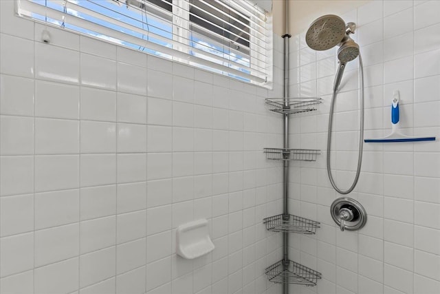 bathroom with tiled shower