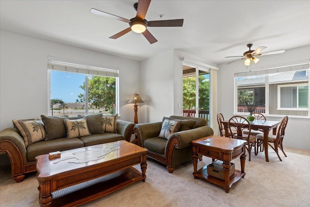 carpeted living room featuring ceiling fan