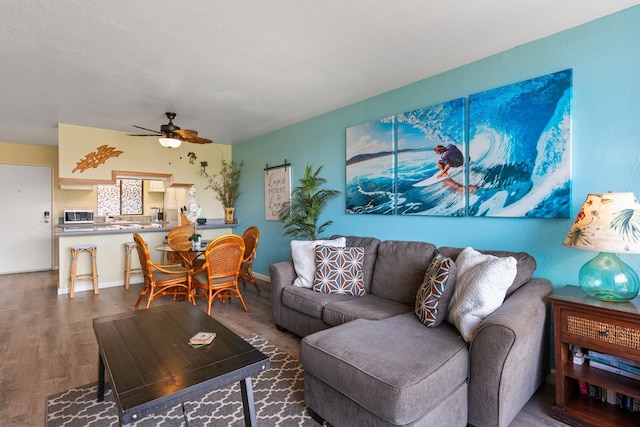 2219 S Kihei Rd Unit B312, Kihei, HI 96753 - living room with wood finished floors and ceiling fan