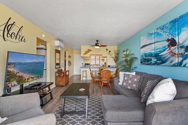 2219 S Kihei Rd Unit B312, Kihei, HI 96753 - living room with wood finished floors and a ceiling fan