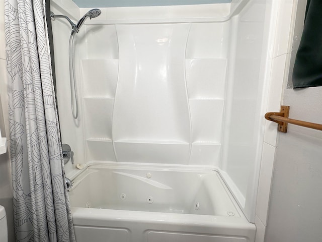 bathroom with shower / tub combo with curtain