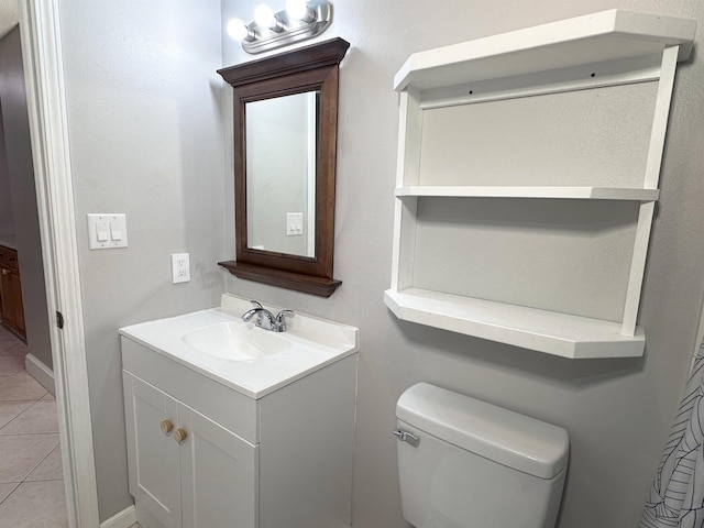 bathroom with tile patterned floors, vanity, and toilet