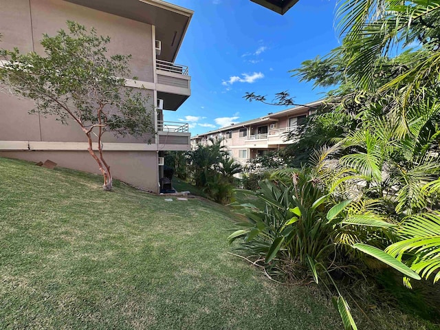 view of yard with a balcony