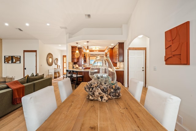 dining space featuring light wood-type flooring