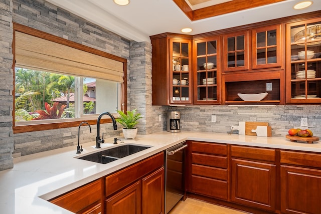 kitchen with dishwasher, light tile patterned floors, backsplash, and sink