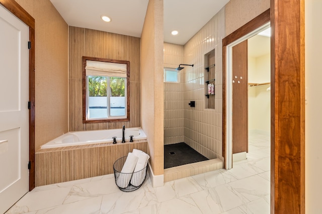 bathroom with separate shower and tub