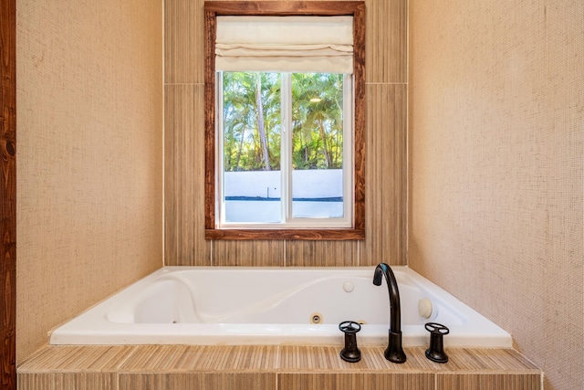 bathroom with tiled tub