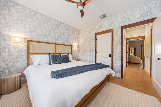 bedroom featuring ceiling fan and light hardwood / wood-style floors