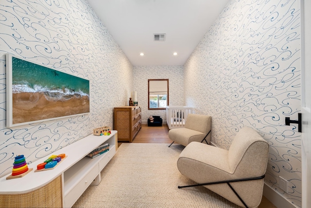 living area with hardwood / wood-style flooring