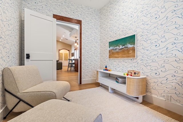 sitting room featuring hardwood / wood-style floors