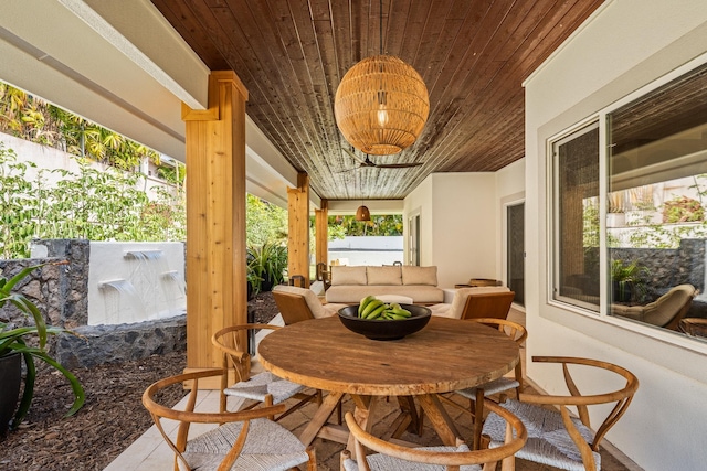 sunroom / solarium featuring wooden ceiling