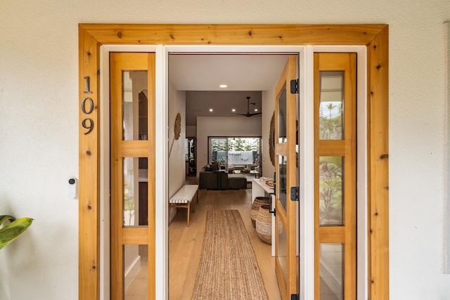 corridor featuring hardwood / wood-style flooring