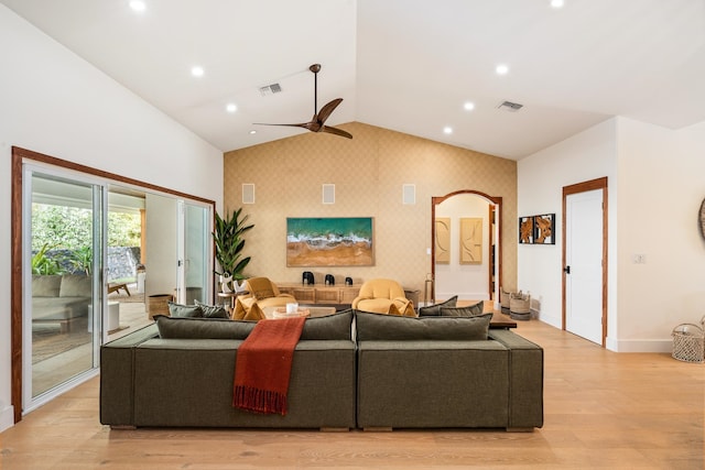 living room featuring light wood-type flooring, ceiling fan, and lofted ceiling