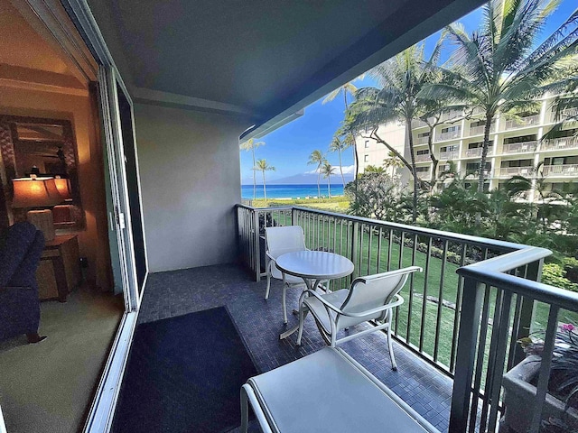 balcony featuring a water view