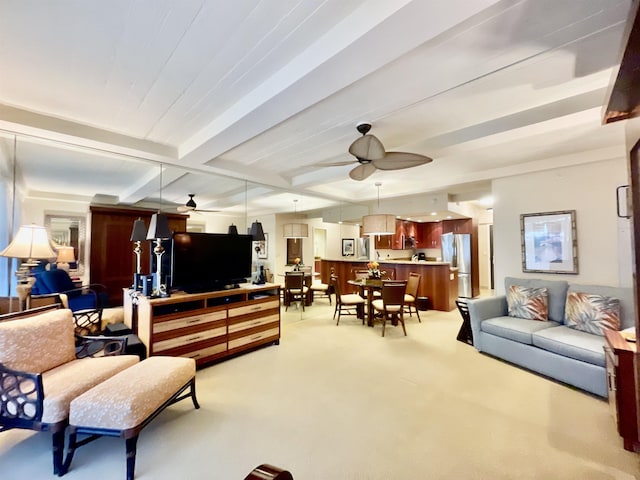 living room with light carpet, ceiling fan, and beamed ceiling