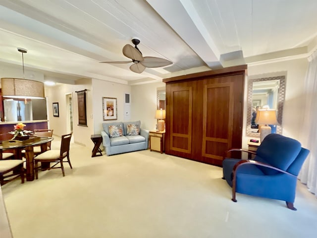 carpeted living room with ceiling fan