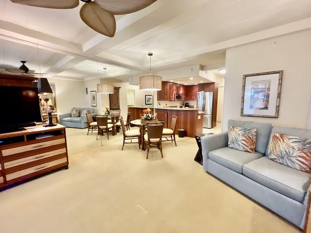 carpeted living room with ceiling fan and beam ceiling