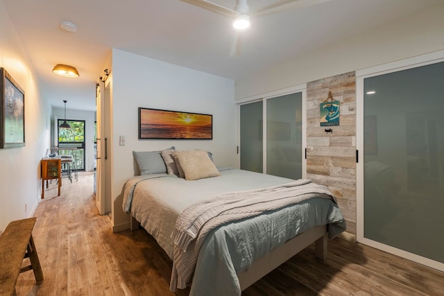 bedroom featuring a closet, ceiling fan, and hardwood / wood-style floors