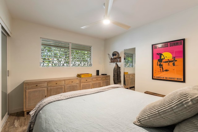 bedroom featuring hardwood / wood-style flooring and ceiling fan