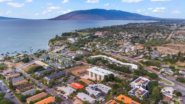 bird's eye view with a water and mountain view