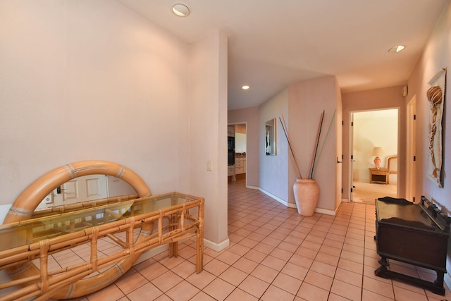 corridor featuring light tile patterned floors