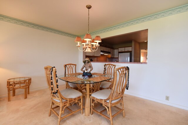 carpeted dining space with a chandelier