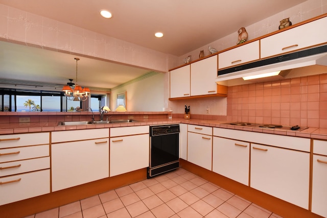 kitchen featuring sink, decorative light fixtures, white cabinetry, dishwasher, and white gas stovetop