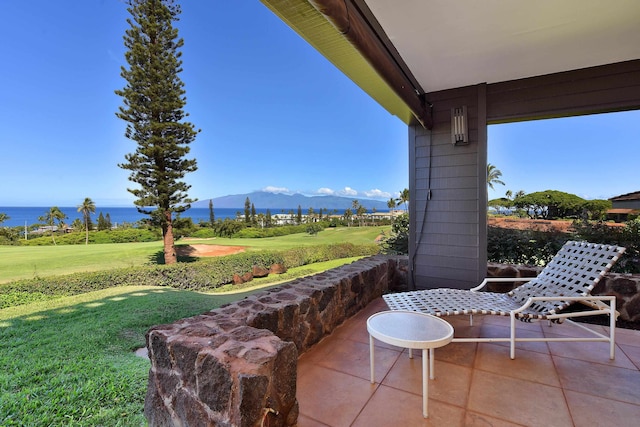 view of patio with a water and mountain view