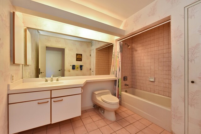 full bathroom featuring shower / bath combo, vanity, toilet, and tile patterned floors